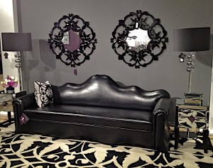 Priscilla Presley Home black leather sofa